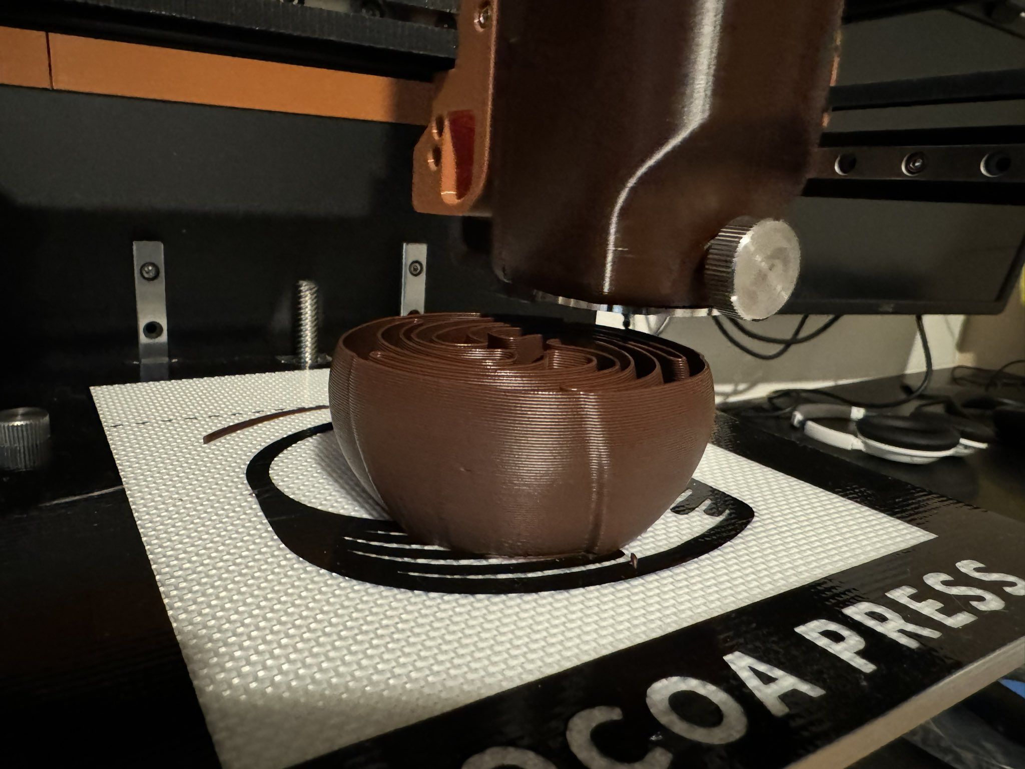 Close-up view of chocolate rose being printed