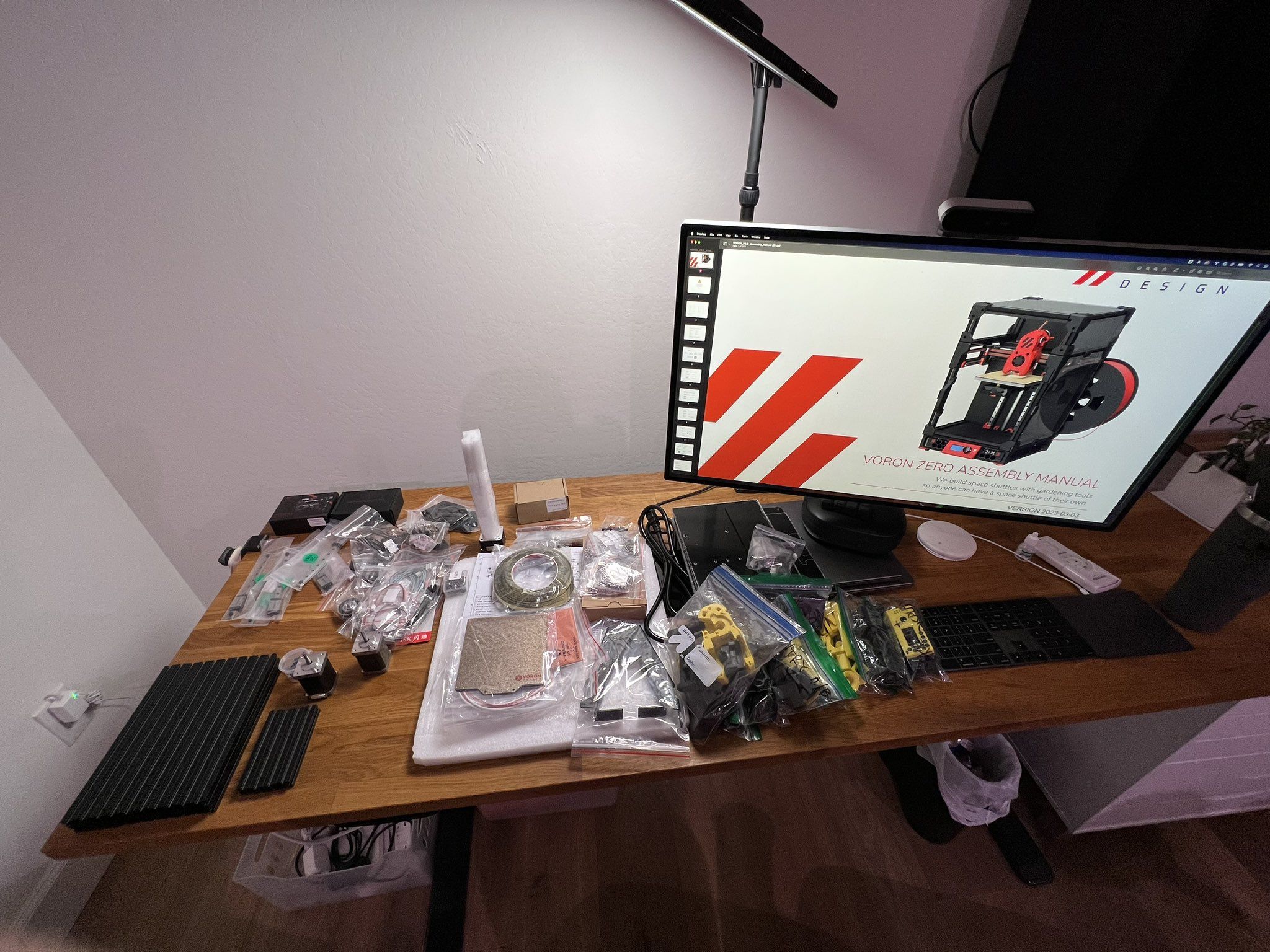 Voron 0 parts spread out on a desk