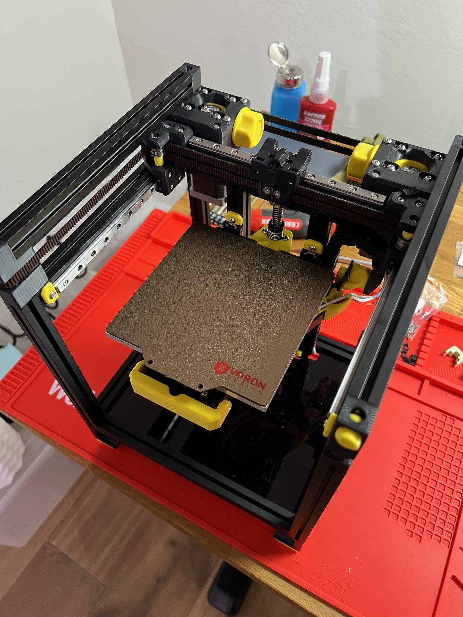 Voron 0 build plate viewed from above showing belt tensioning